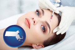 massachusetts map icon and beautiful woman receiving a facial injection