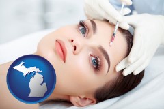 michigan map icon and beautiful woman receiving a facial injection